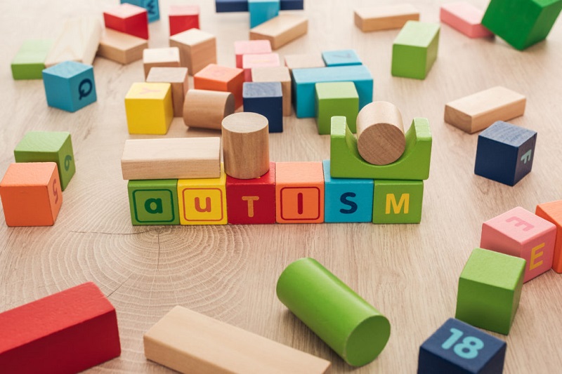 blocks on floor spelling autism